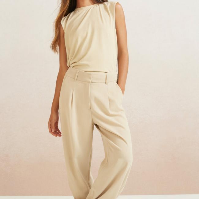 Pantalon large tissé à poche latérale, braguette et plis