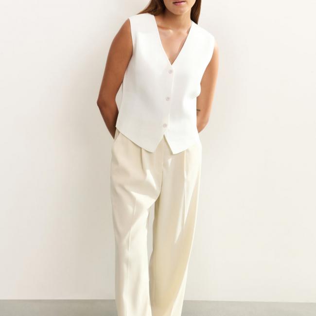 Pantalon large à pince et à revers